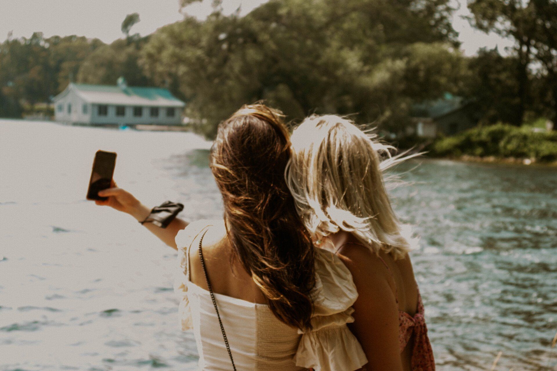 Two women taking photos on their PEC wine tour