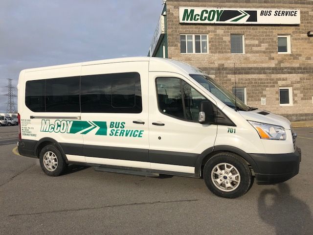 A Deluxe Van operate by McCoy Bus Service