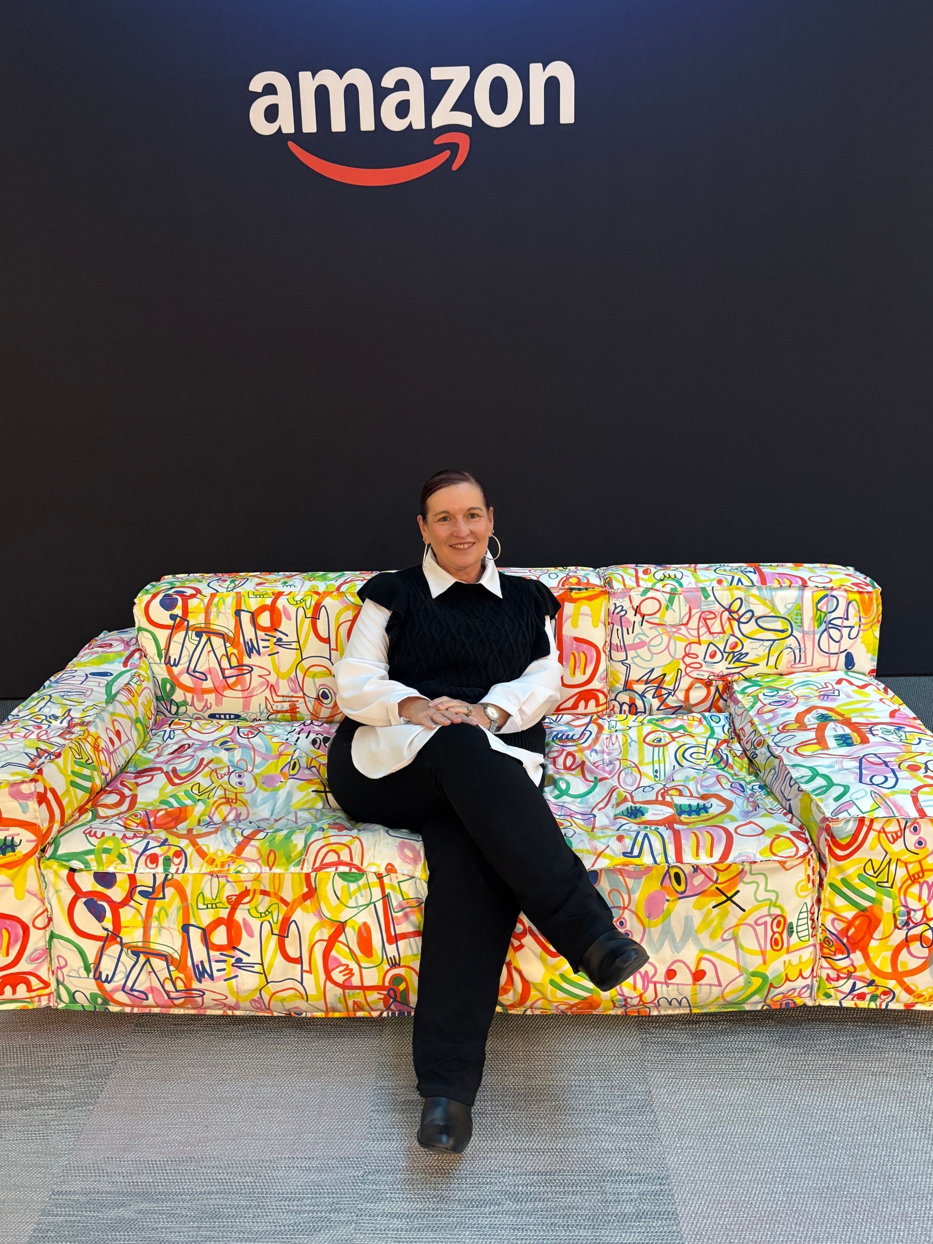 woman sitting on colorful couch