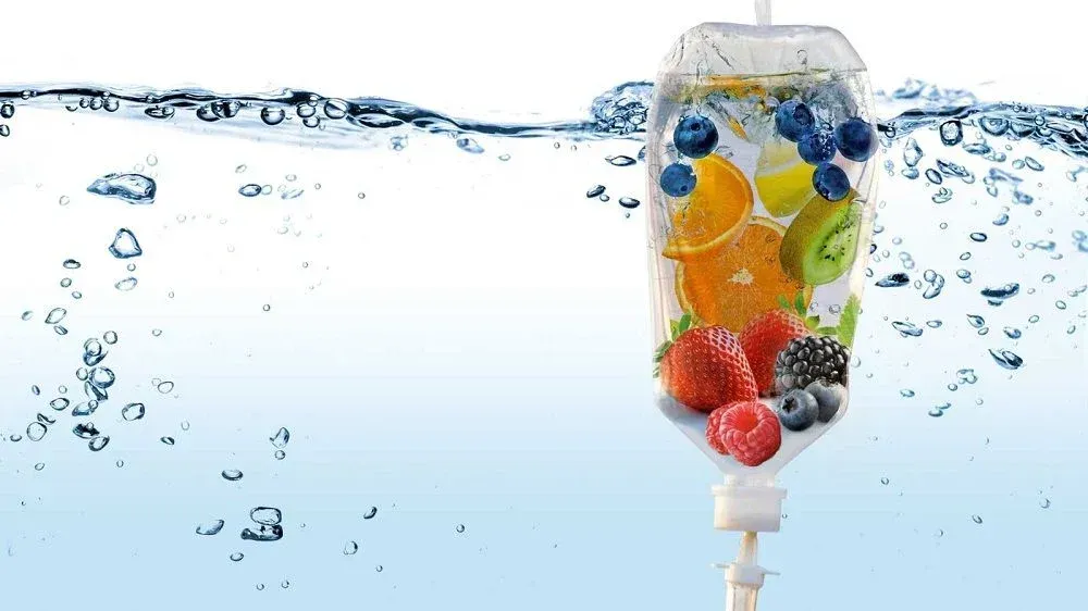 IV bag filled with fruit submerged in water, with bubbles.