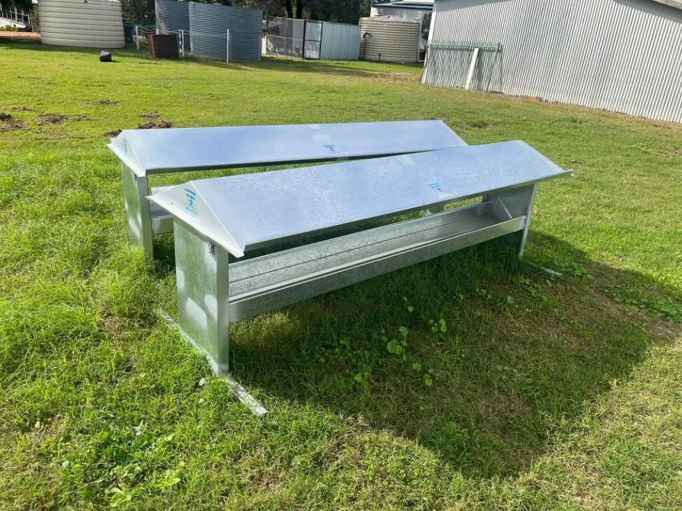 Two Metal Benches Are Sitting on Top of A Lush Green Field — Ballimore Welding in Ballimore, NSW
