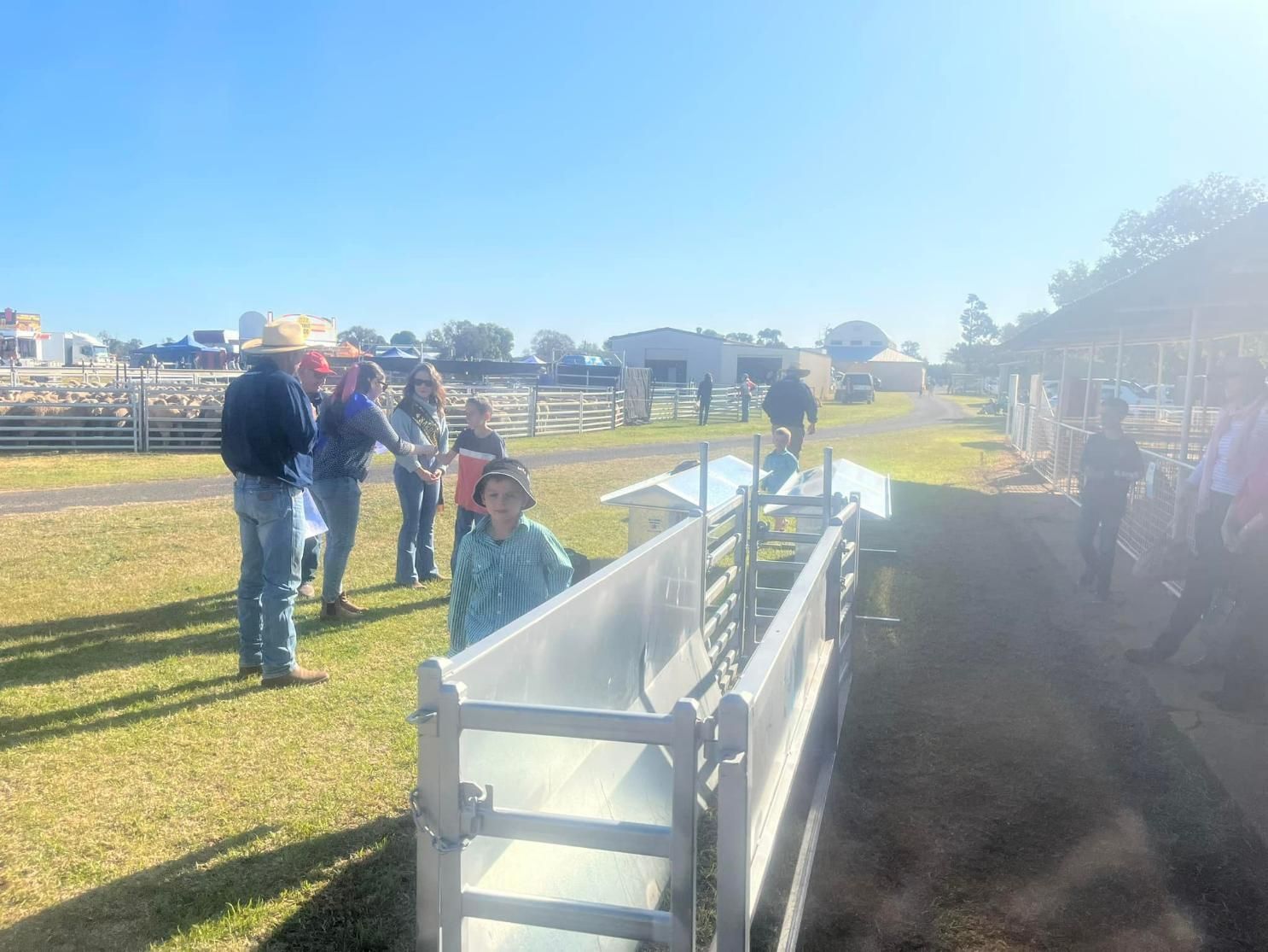 A Group of People Are Standing Around a Fence in A Field — Ballimore Welding in Ballimore, NSW