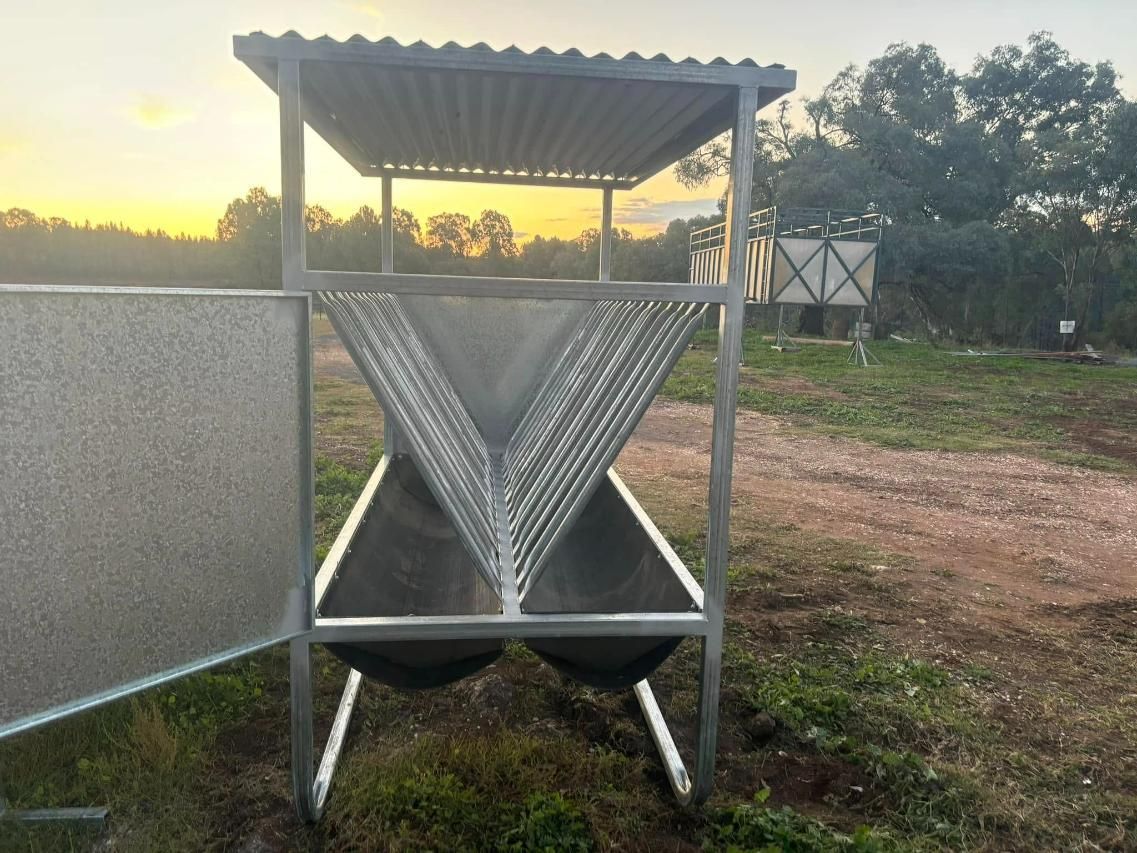 A Metal Structure with Two Stainless Steel Troughs in A Field — Ballimore Welding in Tamworth, NSW