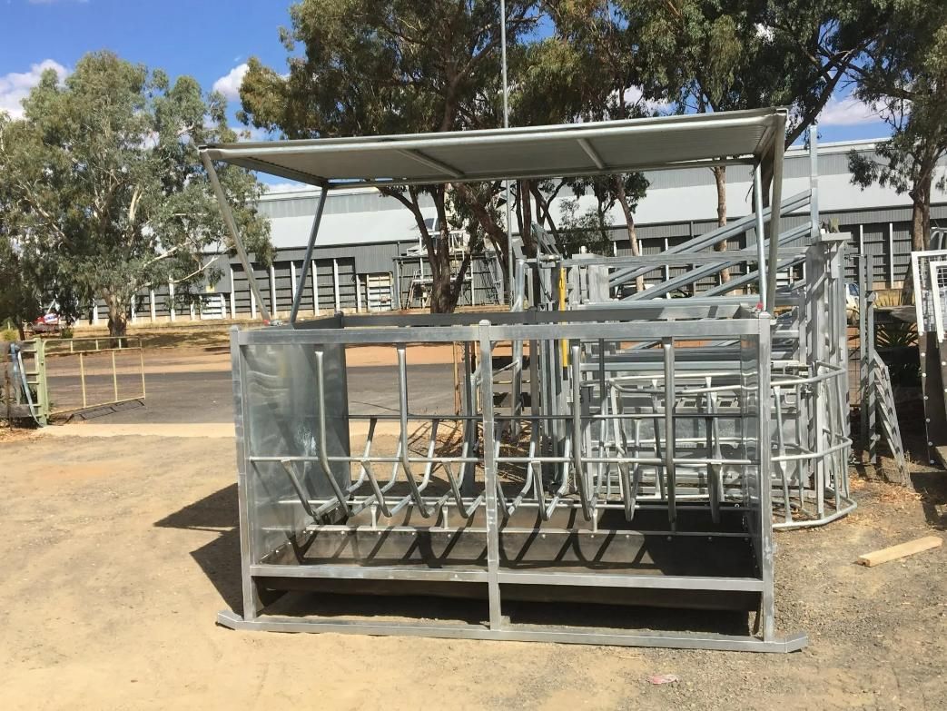 A Metal Structure Is Sitting on Top of A Dirt Field in Front of A Building — Ballimore Welding in Ballimore, NSW