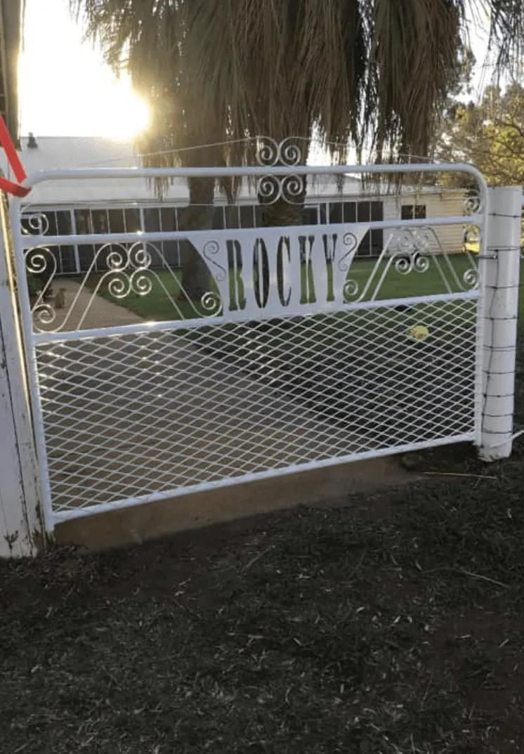A White Gate with The Word Rocky on It — Ballimore Welding in Ballimore, NSW