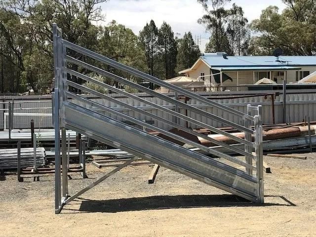 A Metal Staircase Is Sitting on Top of A Dirt Field — Ballimore Welding in Ballimore, NSW