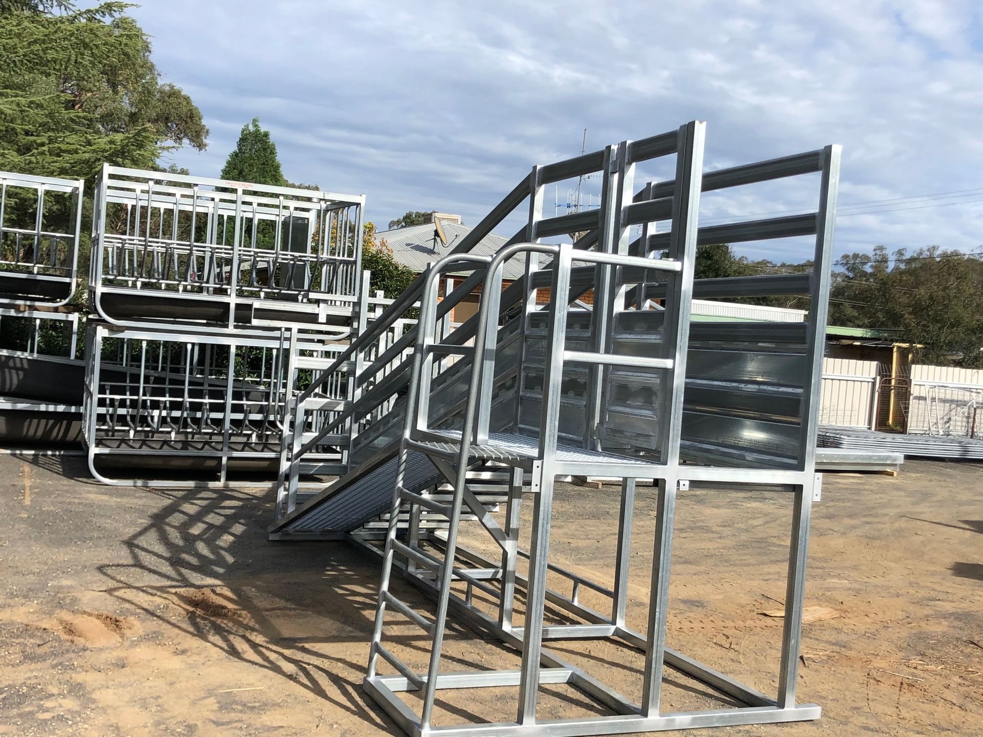 Steel bleachers stacked outdoors.