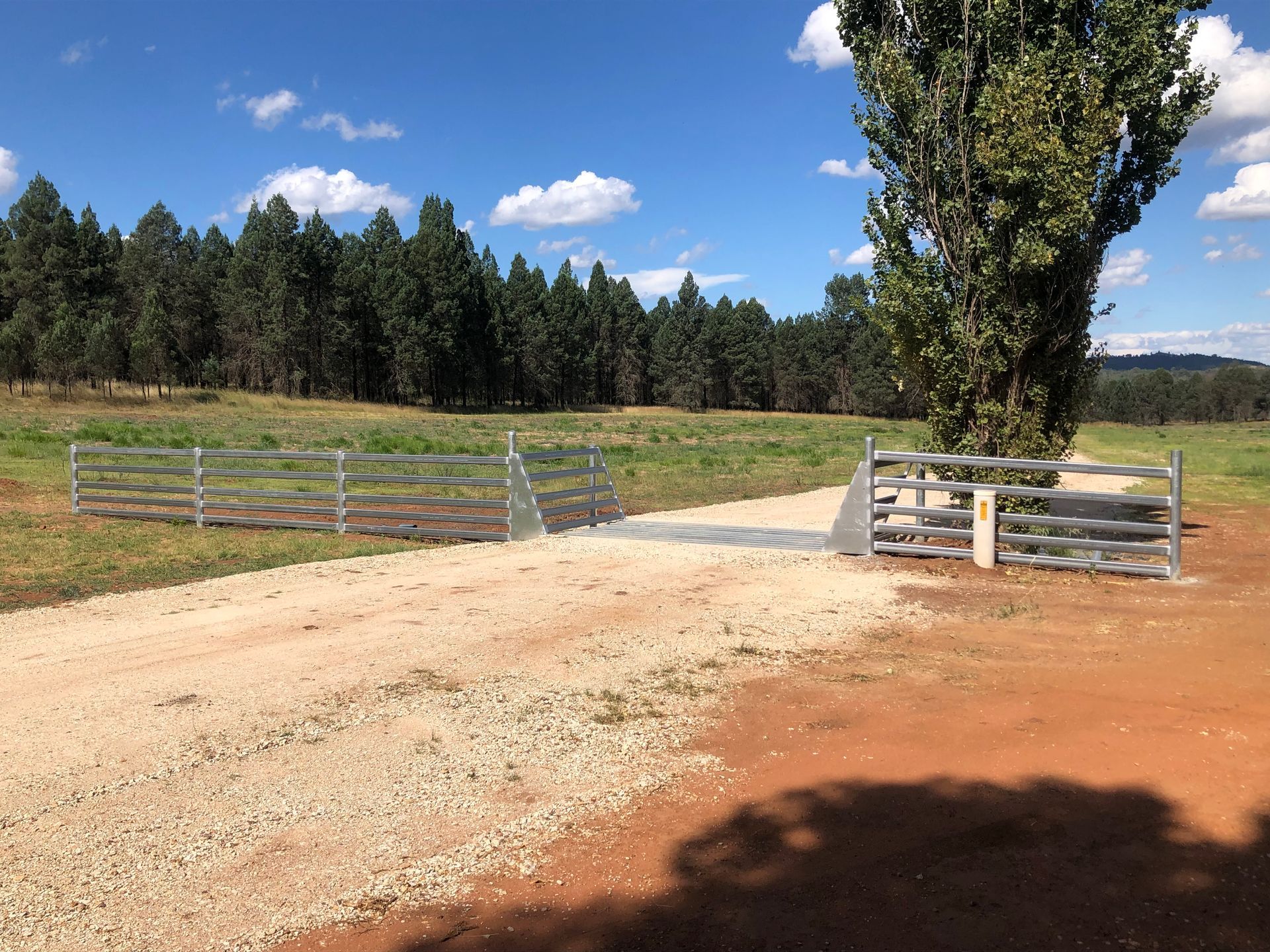An Empty Barn with A Metal Fence and A Metal Floor — Ballimore Welding in Ballimore, NSW