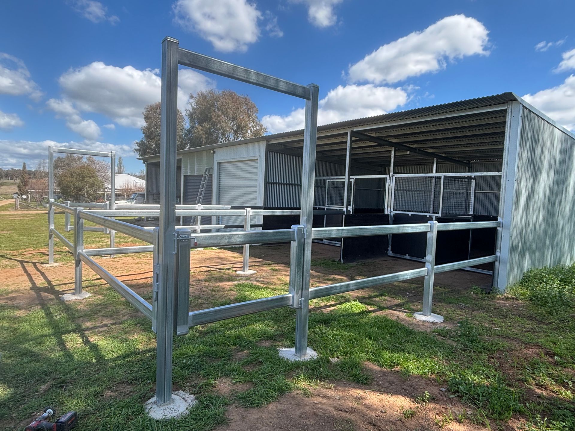 A Horse Stable with A Fence and A Blue Sky in The Background — Ballimore Welding in Ballimore, NSW