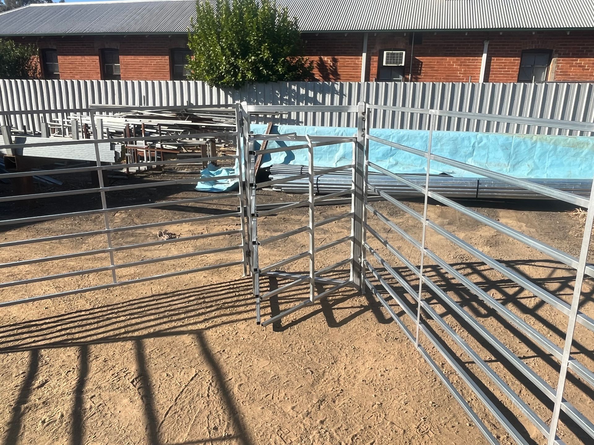 A Herd of Cattle Standing in A Fenced in Area — Ballimore Welding in Ballimore, NSW