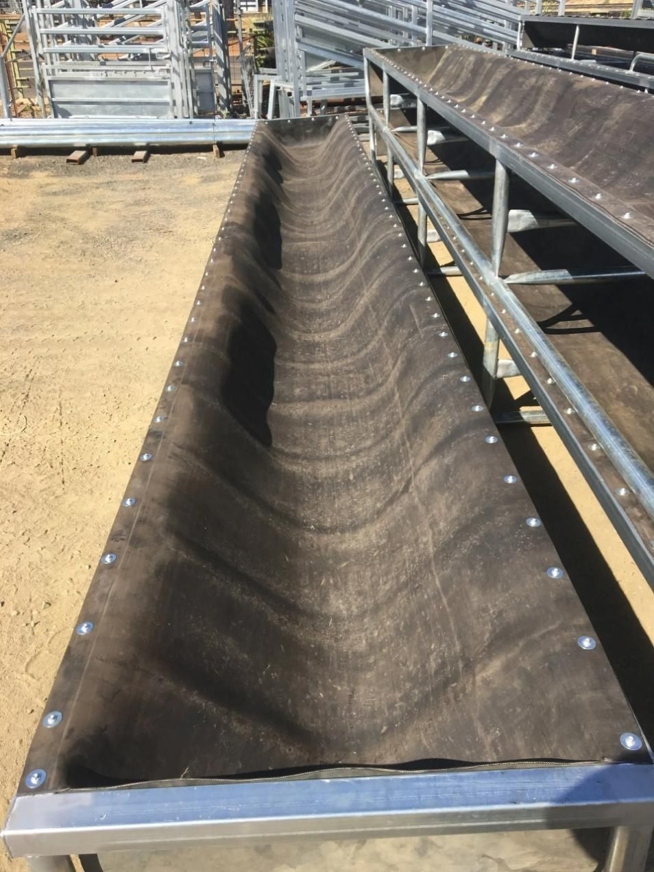 A Row of Metal Fences with A Black Tarp on Top of Them — Ballimore Welding in Ballimore, NSW
