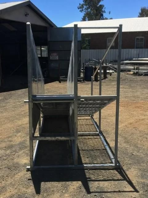 A Metal Structure Is Sitting in The Dirt in Front of A Building — Ballimore Welding in Ballimore, NSW