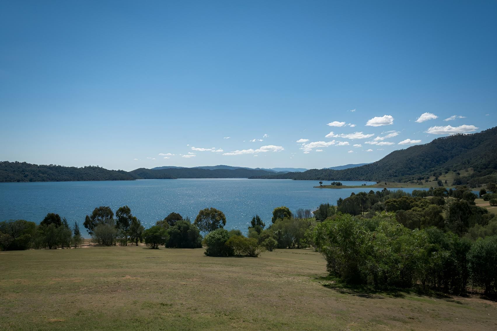 A Large Body of Water Surrounded by Trees and Grass on A Sunny Day — Ballimore Welding in Scone, NSW