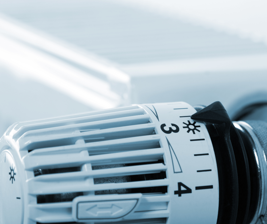 A close up of a thermostat with the number 3 on it