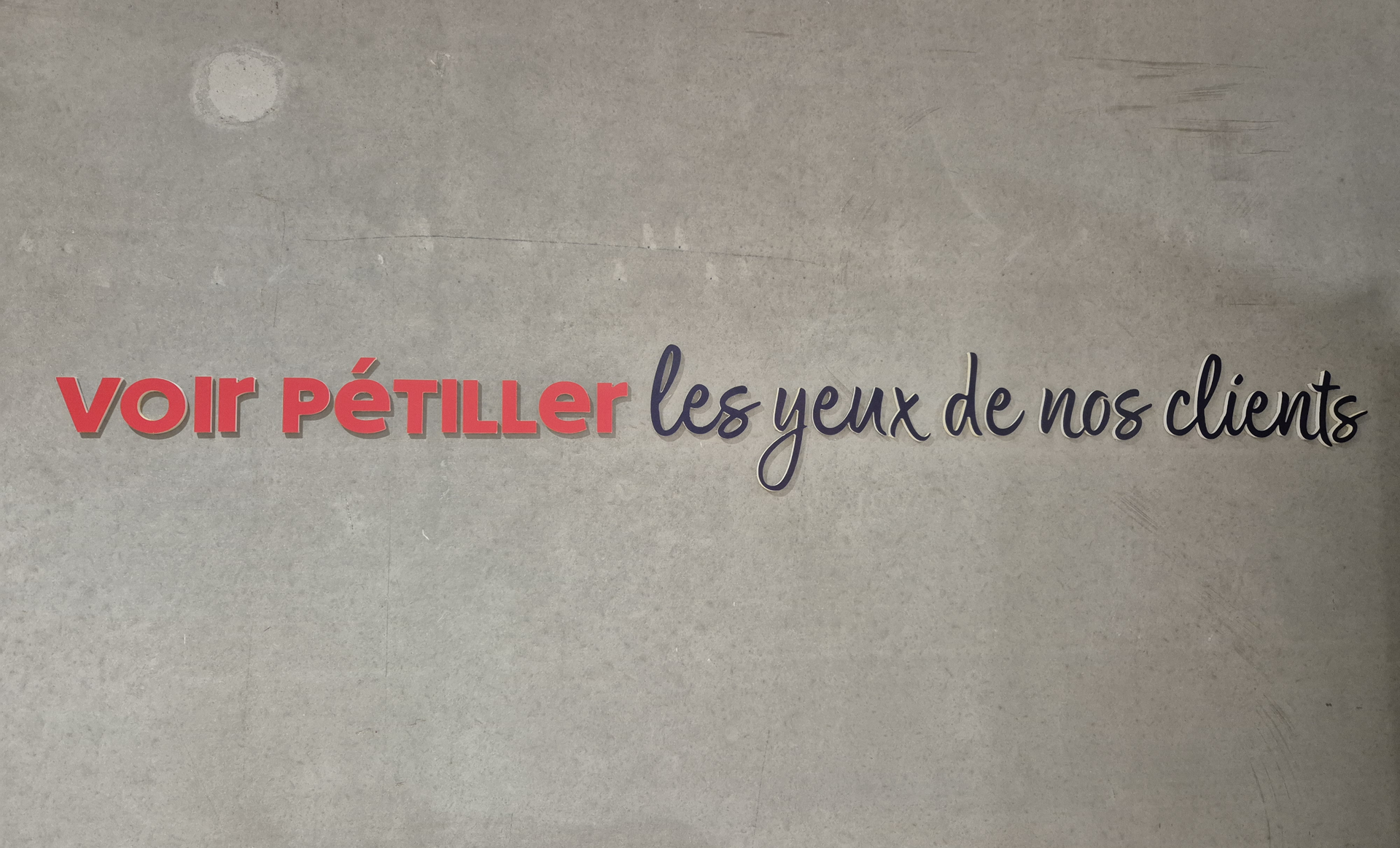 Text on gray wall: 