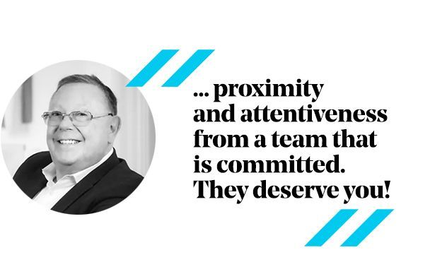 Man in a suit smiling, quote: 