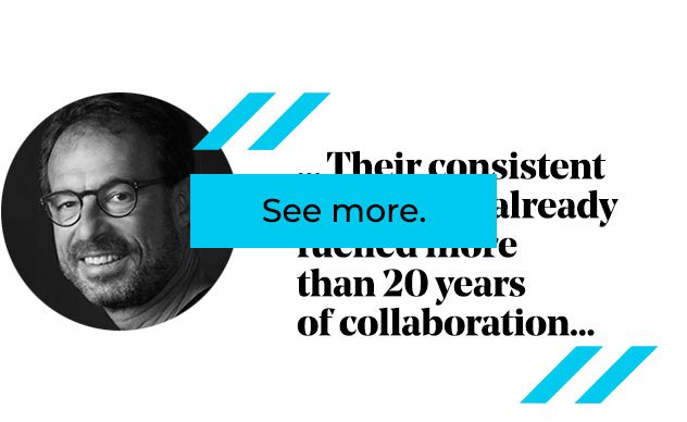 Man in glasses, smiling, text: 