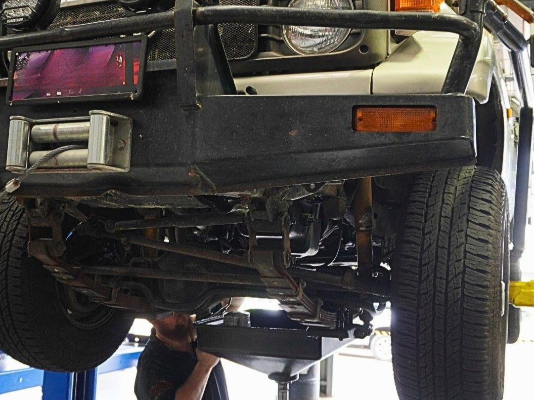 A Mechanic Fixing A Car