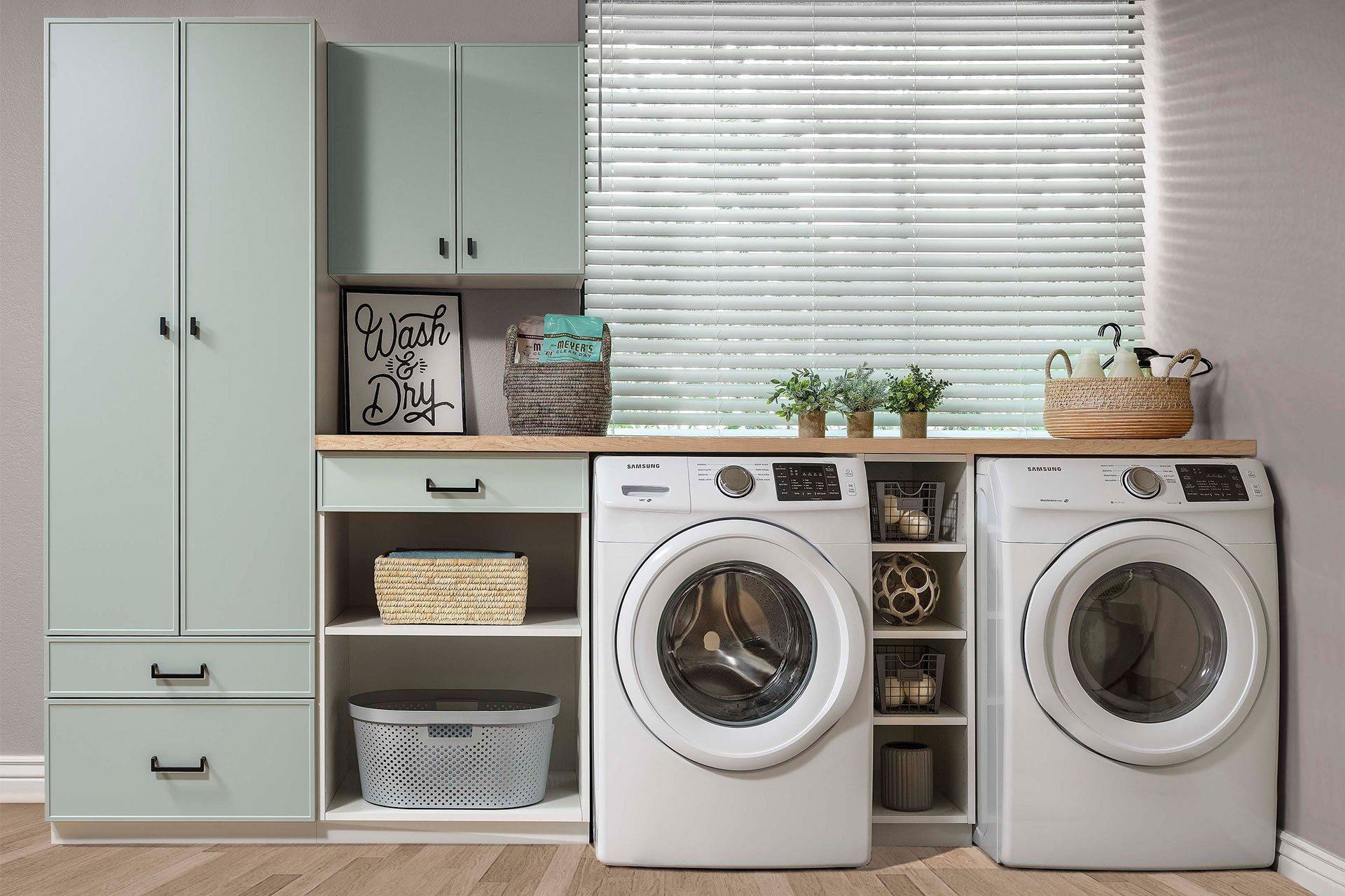 A laundry room with two washing machines and a window.