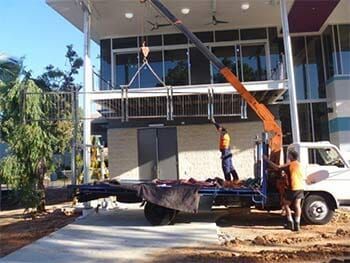 A House Under Construction with a Crane in Front of it — Manufacturing Design Engineering in Garbutt QLD
