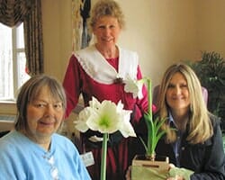 Senior Women with Flowers — Twenty-four hour caregivers on site in Parma, OH