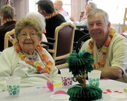 Elders at Hawaiian Theme Party — Twenty-four hour caregivers on site in Parma, OH