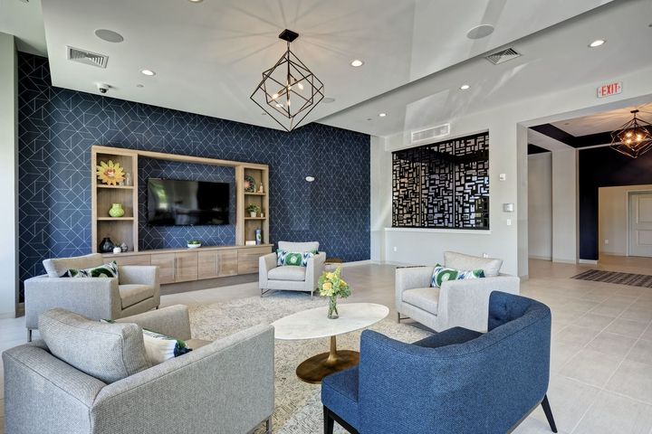 A living room filled with furniture and a television.