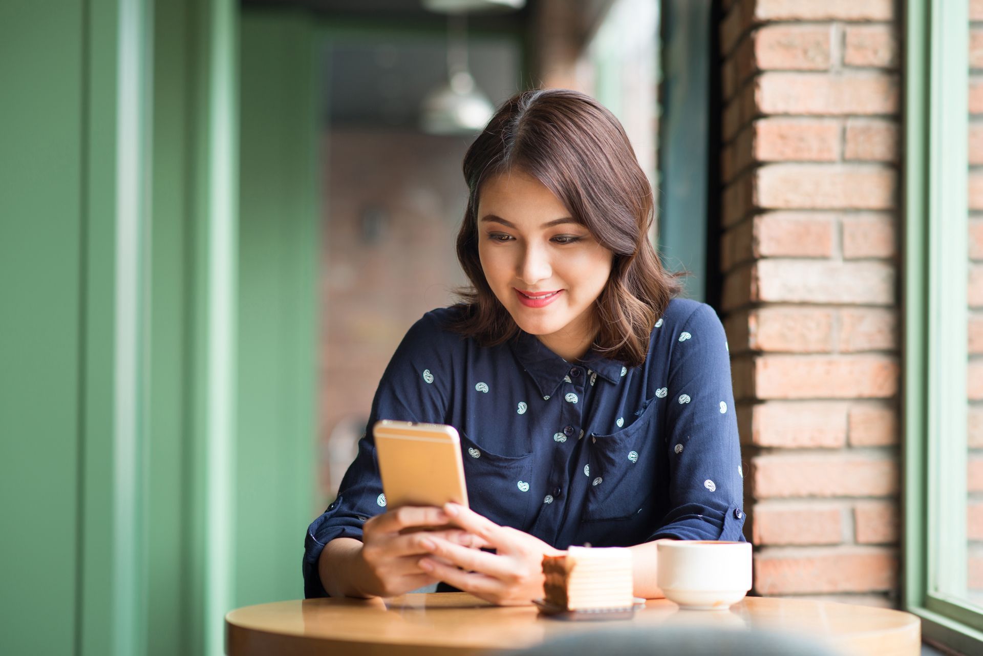 Happy Woman Using Her Phone