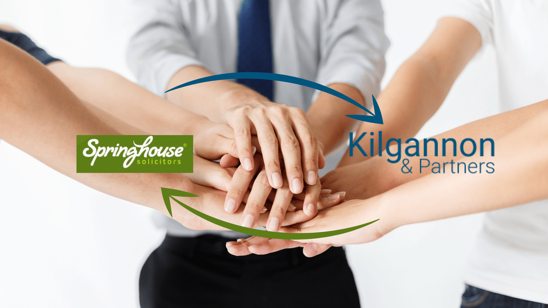 A group of people placing their hands on top of one another with Springhouse and Kilgannon & Partners logos in the center.