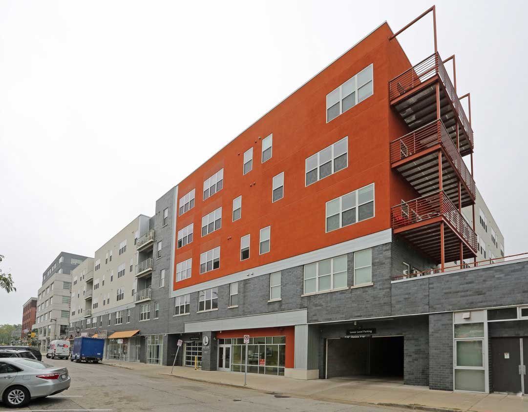 A large red building with stairs on the side of it