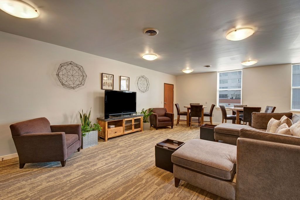 A living room filled with furniture and a flat screen tv.