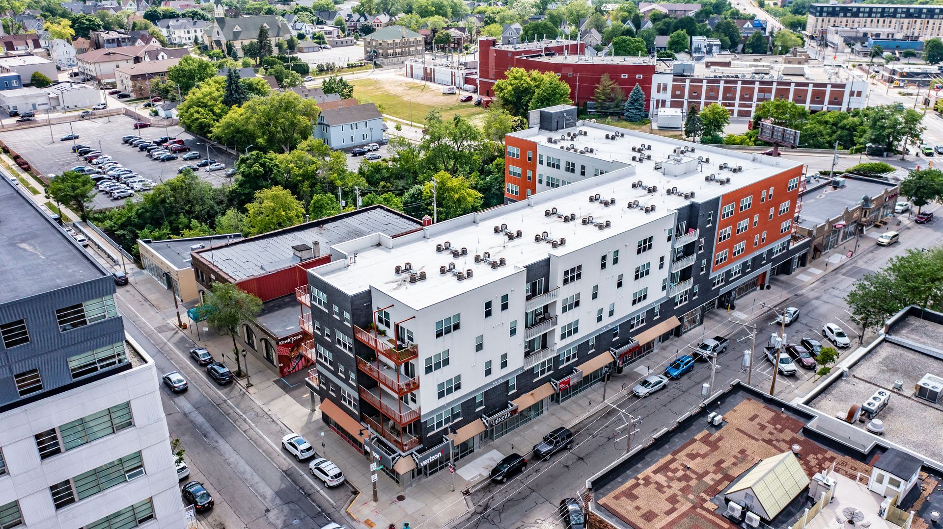 An aerial view of a large building in the middle of a city.