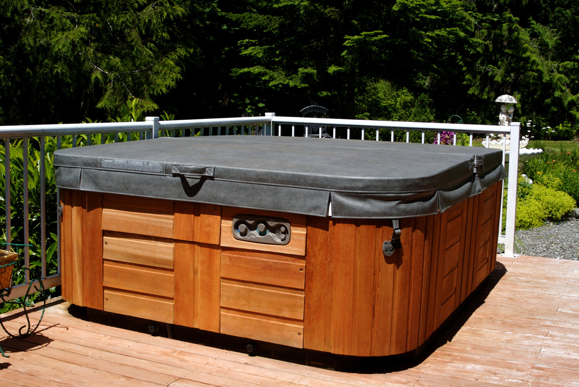 A dumpster filled with trash is parked on the side of the road.