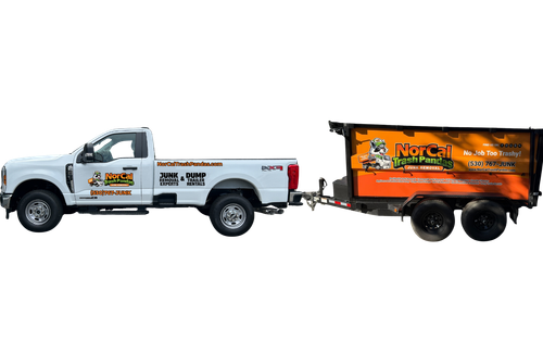A ram truck with a trailer full of trash on a white background.