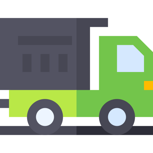 A green and black truck is driving down the road.