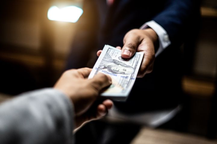 Man Giving Money - Houston, MS - Houston Check Cashers