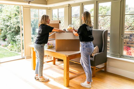 helen and ruth busy packing for a house move