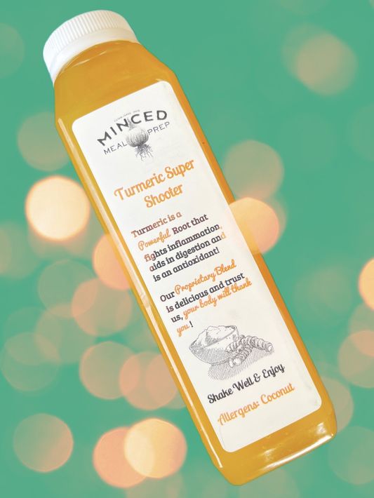 A bottle of minced turmeric super shooter juice