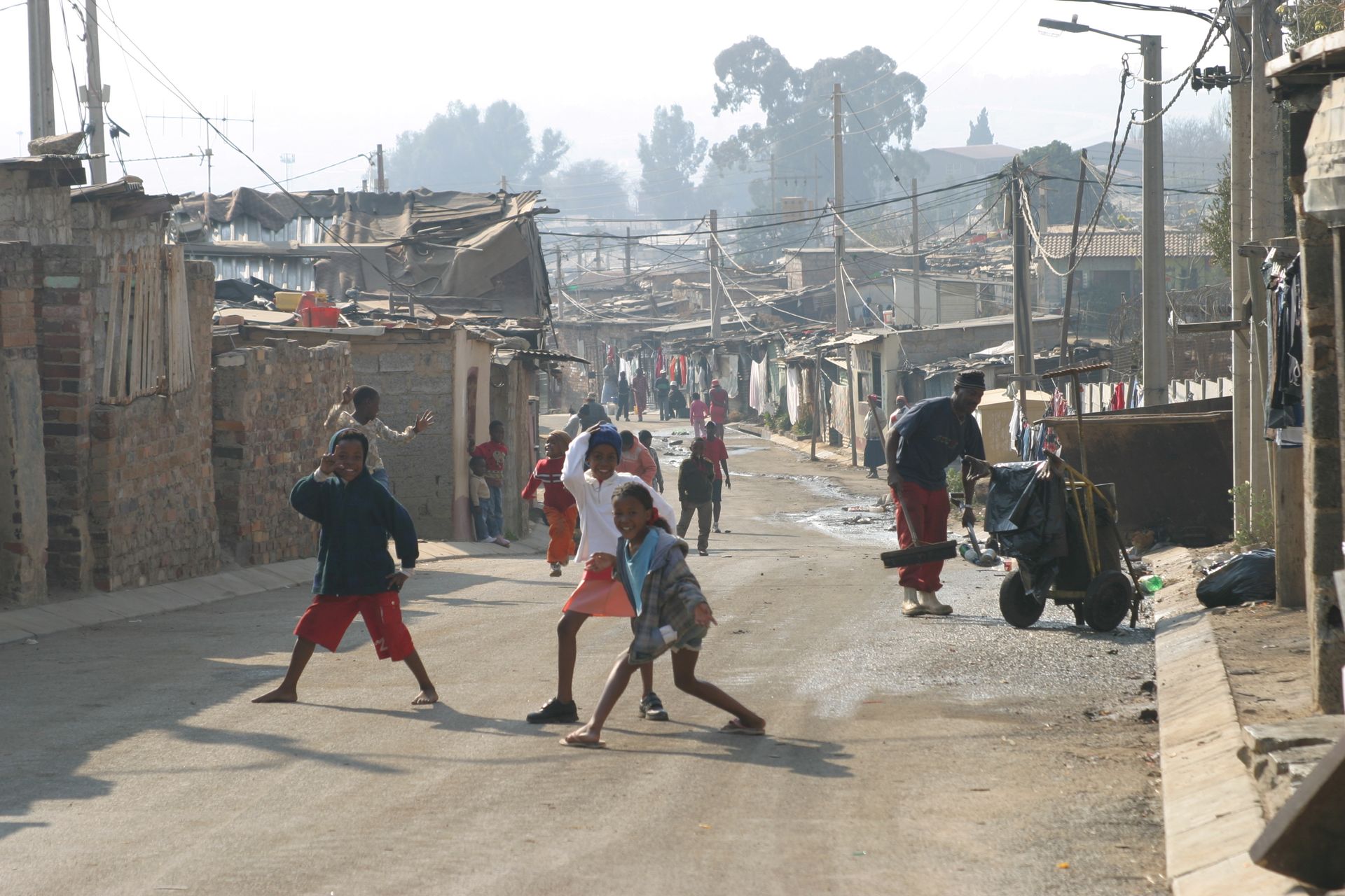 A group of children are playing on a street
