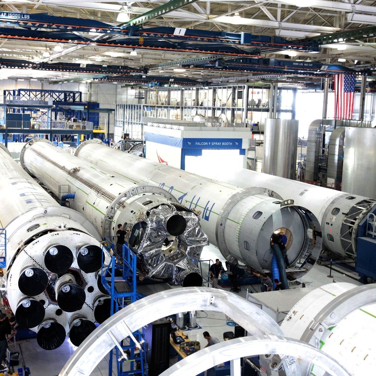 A bunch of rockets are lined up in a factory