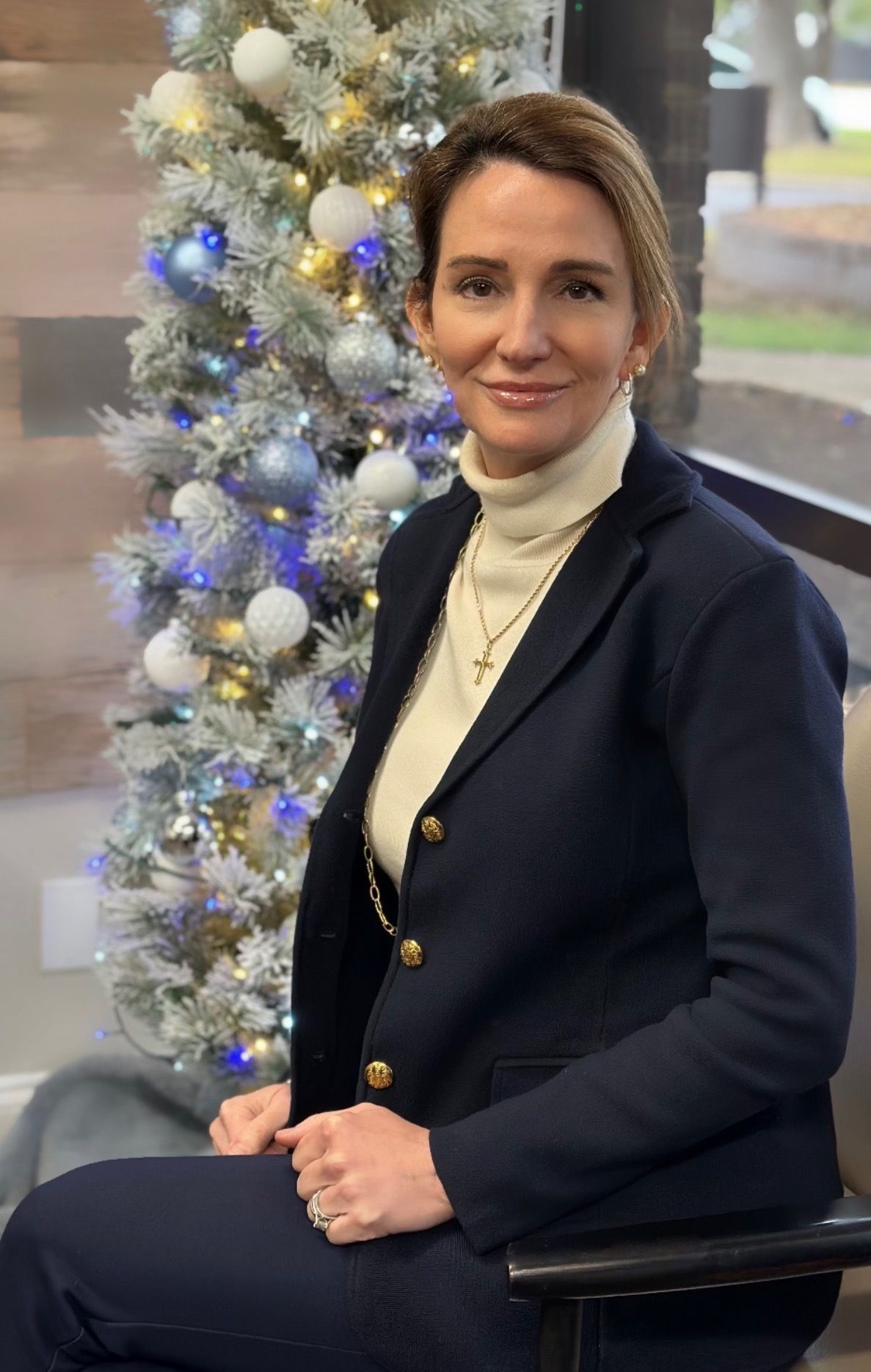 Dr. Karen Architect stands in front of a sign that says family practice architect dnp
