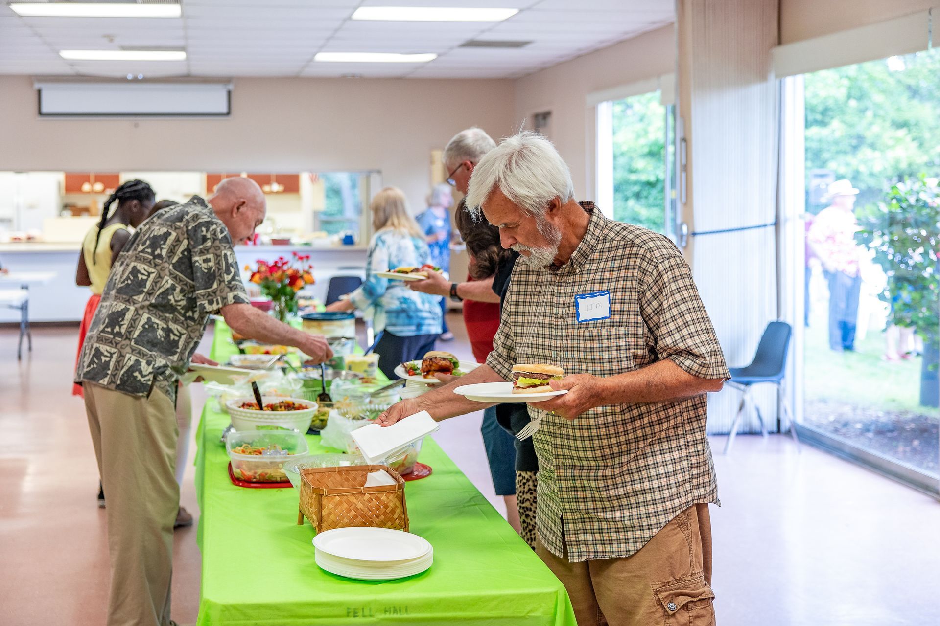 A group of people at a buffet table.