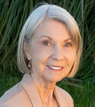 Linda Baldwin is smiling for the camera.