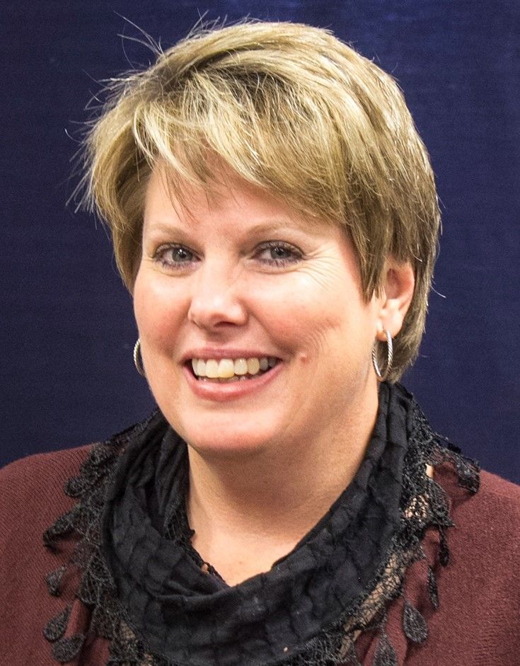 Lori Schnell smiles for the camera.