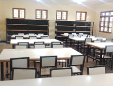 A large room with tables and chairs in it