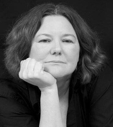 Anne Merino has her hand on her chin.