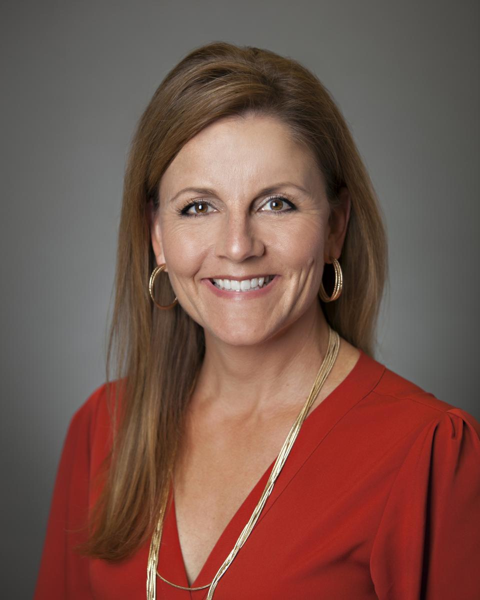 Heather Tanfani is smiling for the camera.