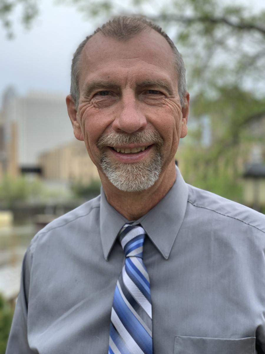 John Wickeraad is smiling for the camera.