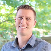 Pastor Ralph smiling for the camera.