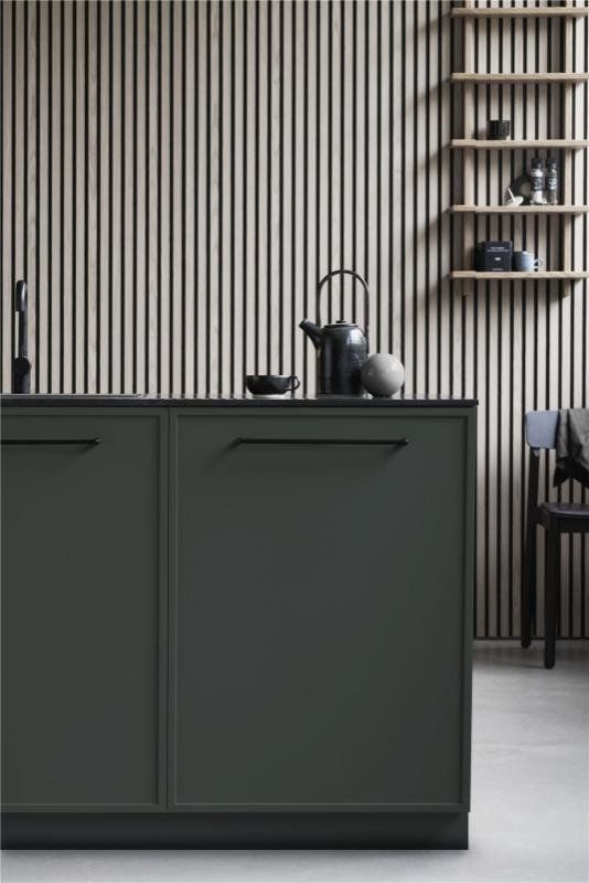 Equester Black Handle on green kitchen and wooden slat wall behind
